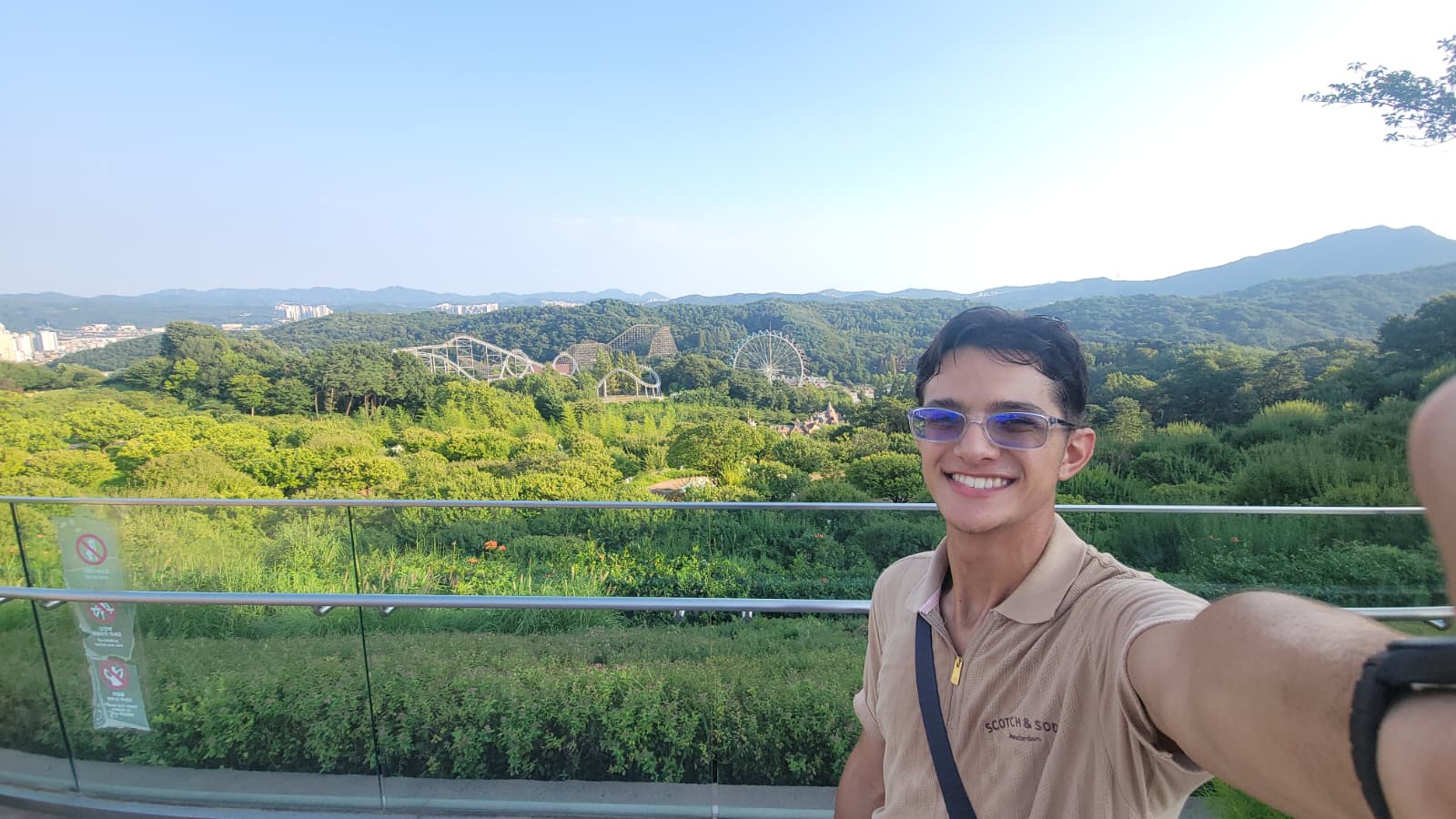 Alberto overlooking an amusement park